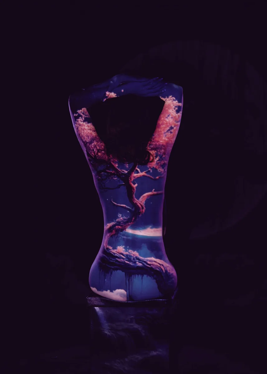Silhouette of a person with a detailed projection of a twisted tree with pink blossoms and clouds on their back, set against a dark background
