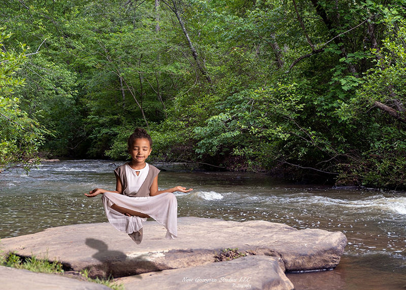 Cosplay girl meditating serene nature